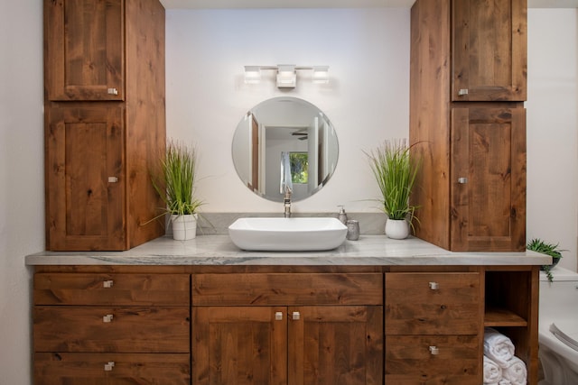 bathroom featuring vanity and toilet