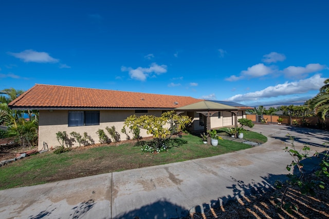 ranch-style home with a front yard