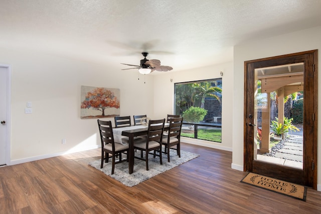 dining space featuring ceiling fan, dark hardwood / wood-style floors, and a textured ceiling