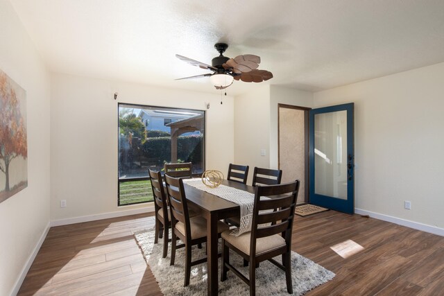 dining space with hardwood / wood-style floors, french doors, and ceiling fan