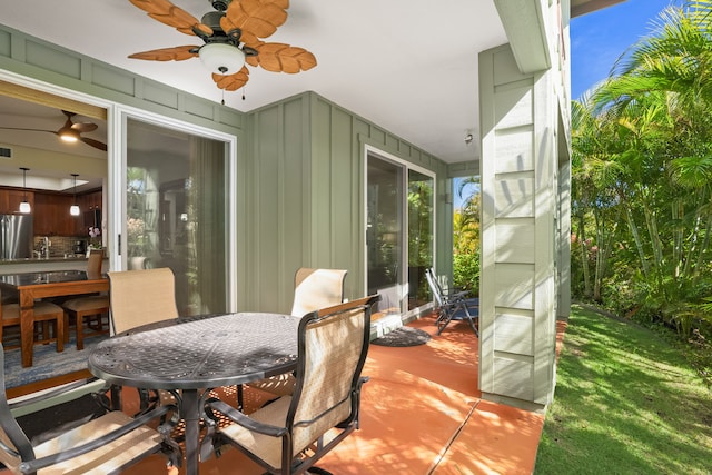 view of patio with a ceiling fan and outdoor dining space