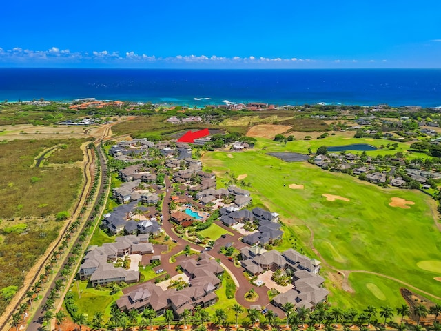aerial view with golf course view, a residential view, and a water view