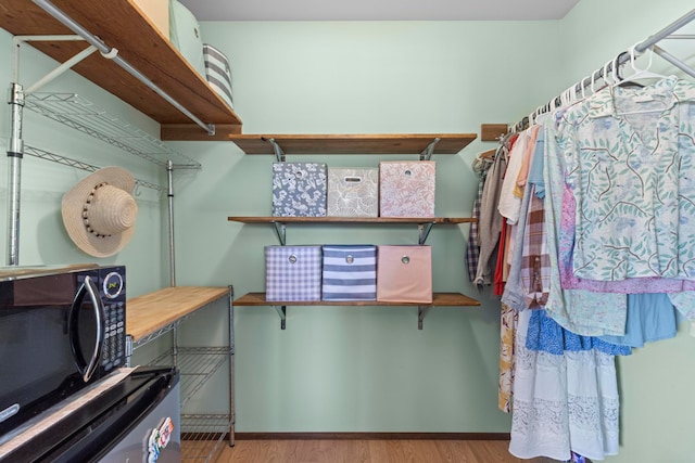 spacious closet with light wood-type flooring