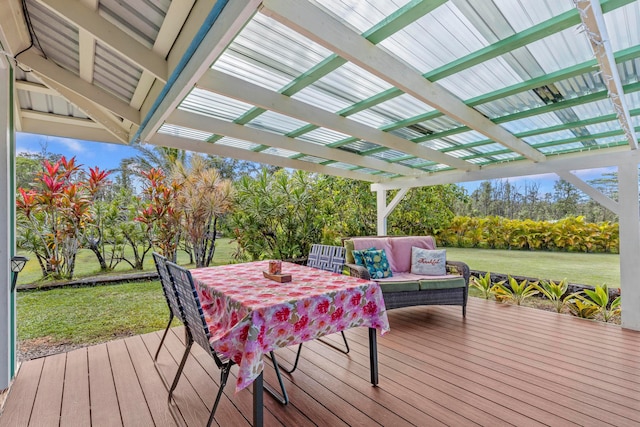 wooden terrace featuring outdoor lounge area and a lawn