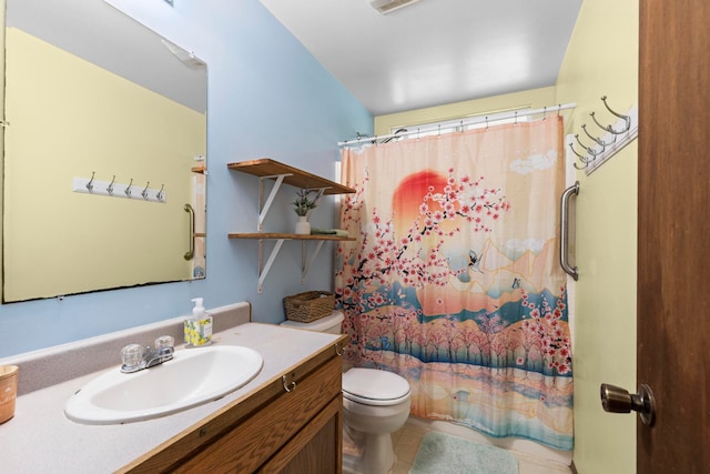 bathroom featuring toilet, curtained shower, vanity, and tile patterned flooring