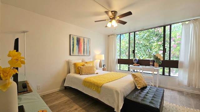 bedroom featuring hardwood / wood-style flooring and ceiling fan