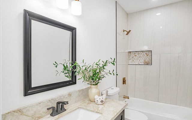 full bathroom featuring vanity, toilet, and tiled shower / bath combo