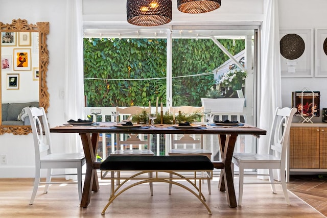 dining space featuring hardwood / wood-style floors