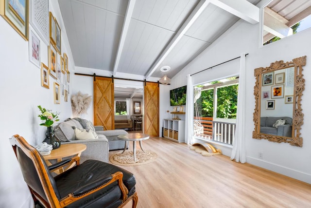 living area featuring a barn door, wooden ceiling, vaulted ceiling with beams, and light hardwood / wood-style flooring