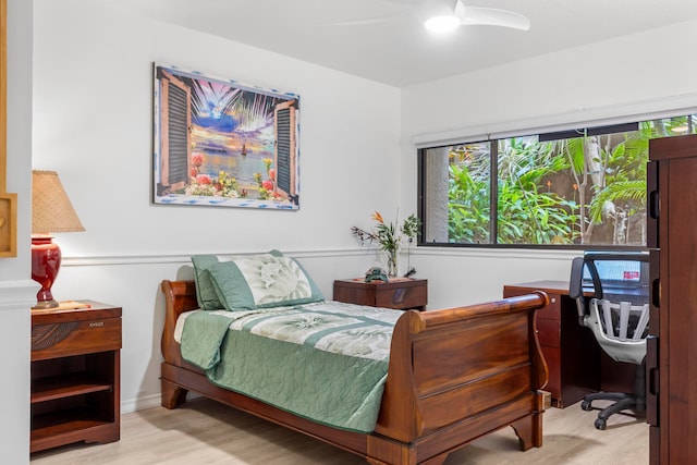 bedroom with ceiling fan and light wood-type flooring