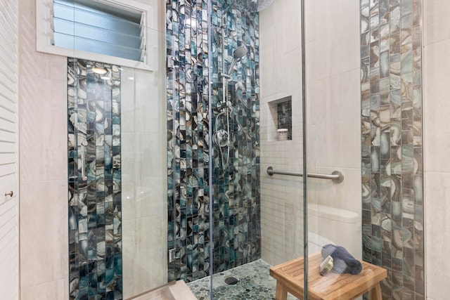 bathroom with tiled shower