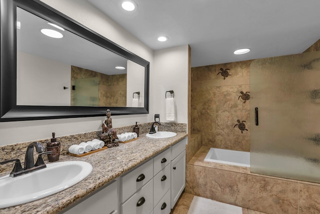 bathroom with vanity, independent shower and bath, and tile patterned floors