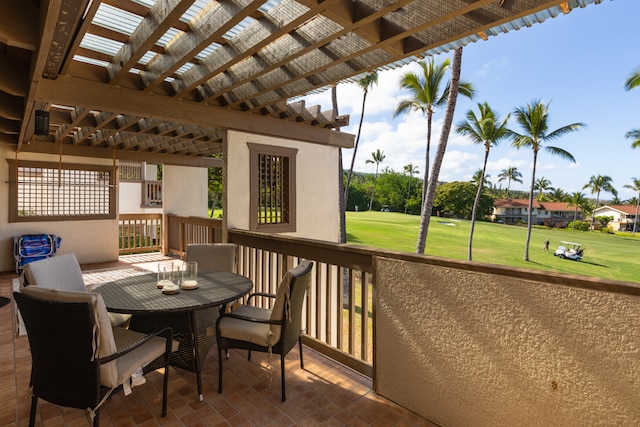 wooden deck featuring a yard, a patio area, and a pergola