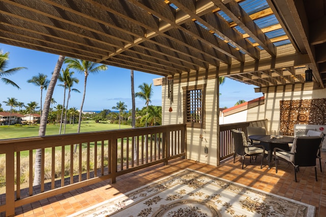 wooden terrace with a pergola, a patio, and a yard