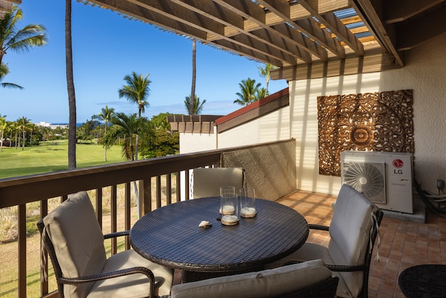 balcony with ac unit and a pergola