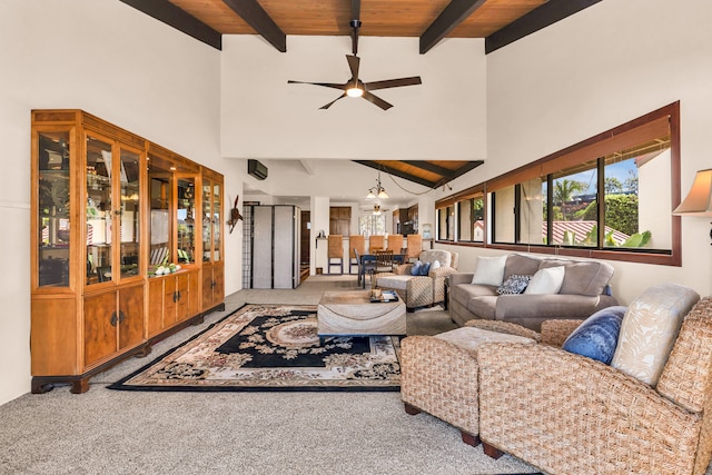 carpeted living room featuring wood ceiling, beam ceiling, high vaulted ceiling, and ceiling fan