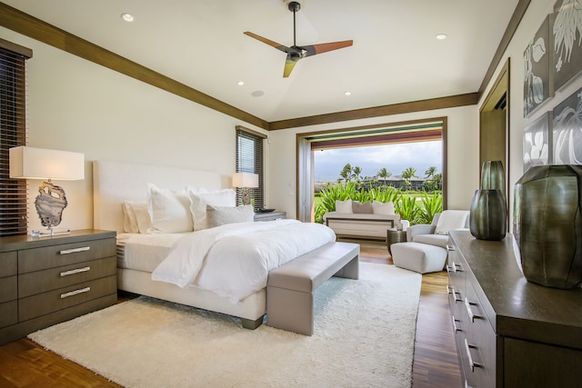 bedroom with ceiling fan and dark hardwood / wood-style floors