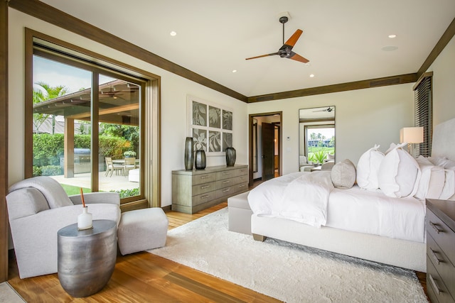 bedroom with crown molding, access to exterior, light hardwood / wood-style floors, and ceiling fan