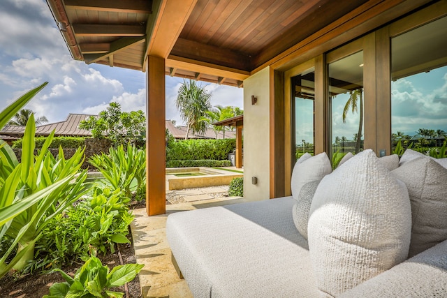 view of patio / terrace featuring an in ground hot tub