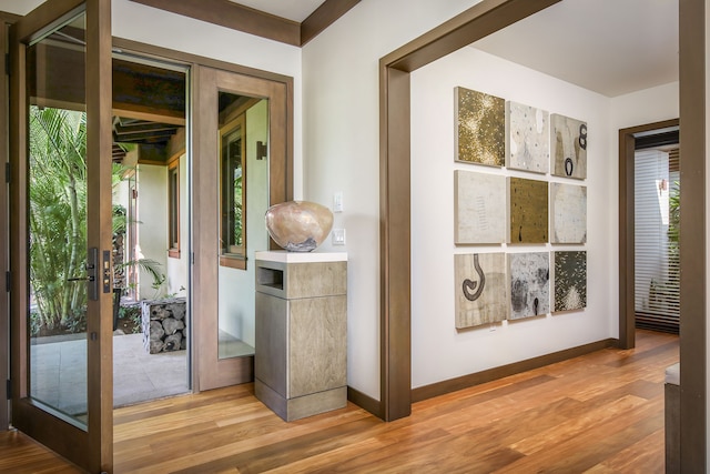 doorway to outside featuring french doors and hardwood / wood-style flooring