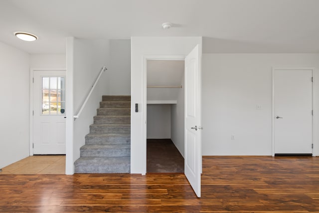 stairway with hardwood / wood-style flooring