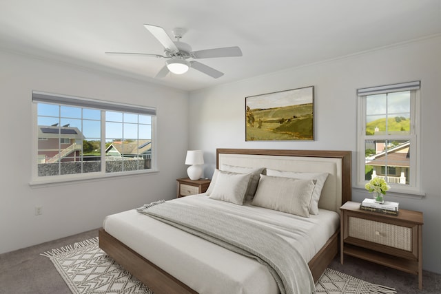 bedroom featuring ceiling fan, light colored carpet, and crown molding