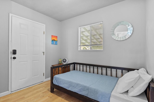 bedroom with light wood-type flooring