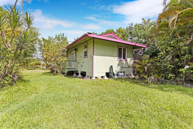 view of home's exterior with a lawn