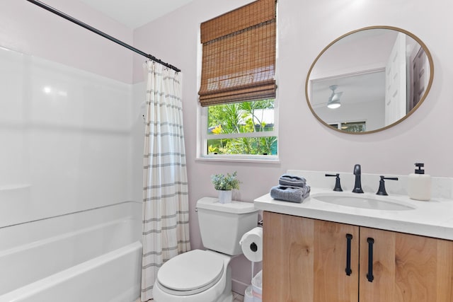 full bathroom with toilet, vanity, and shower / bathtub combination with curtain