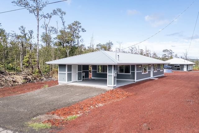 single story home with a carport