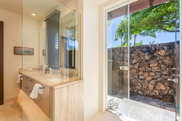 bathroom featuring vanity, walk in shower, and tile patterned flooring