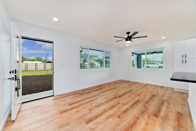 interior space featuring light hardwood / wood-style floors and ceiling fan