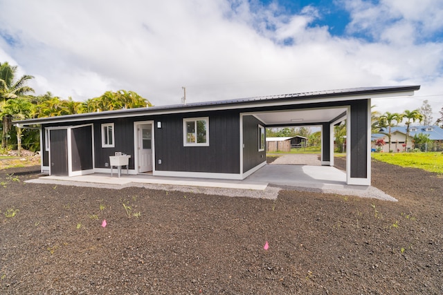 back of property featuring a patio area