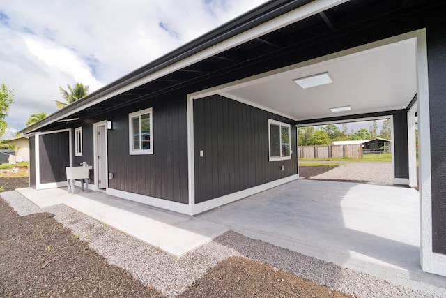 view of side of home featuring a patio