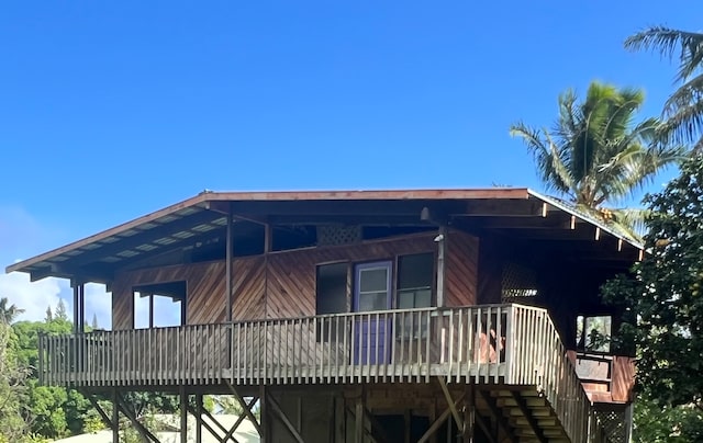 view of home's exterior featuring a wooden deck