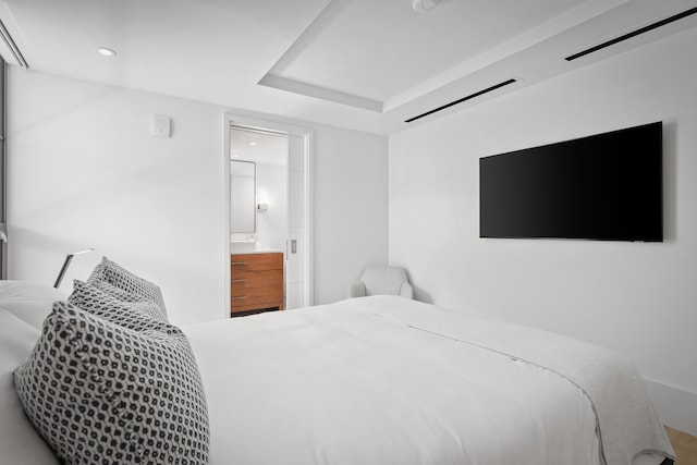 bedroom featuring connected bathroom