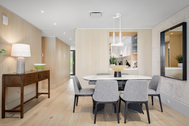 dining space featuring light wood-type flooring