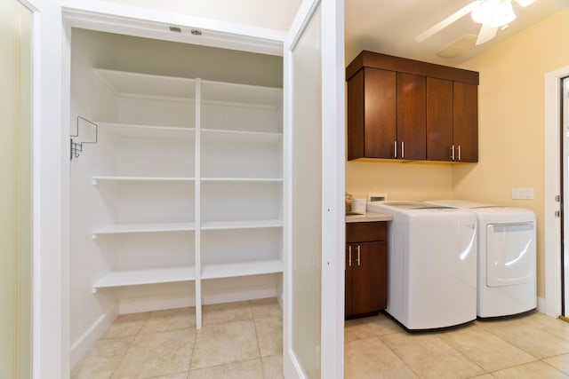 laundry room with cabinets, light tile patterned floors, independent washer and dryer, and ceiling fan