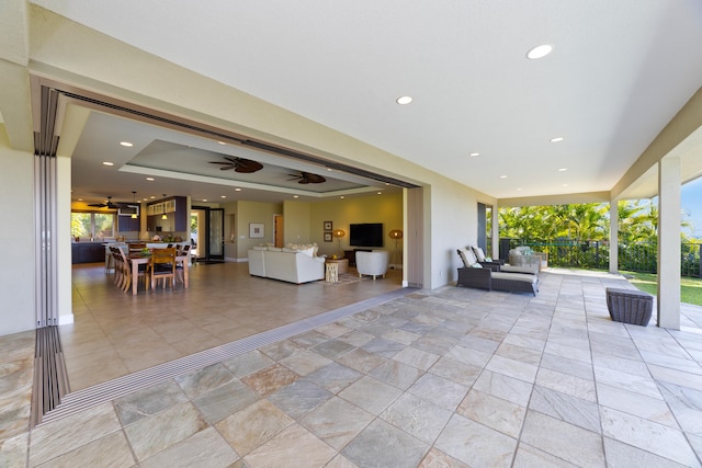 view of patio / terrace featuring outdoor lounge area and ceiling fan