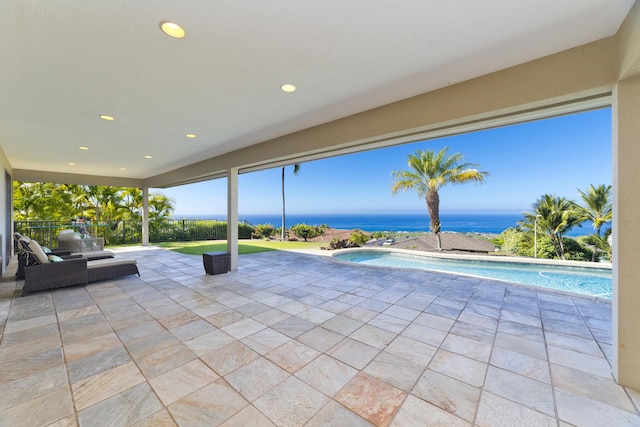 view of patio with a water view