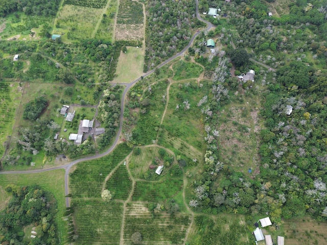 birds eye view of property with a rural view