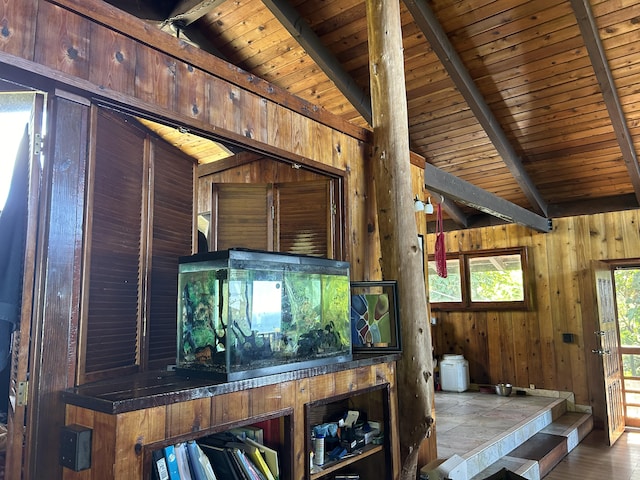 details featuring beam ceiling, wood ceiling, and wooden walls