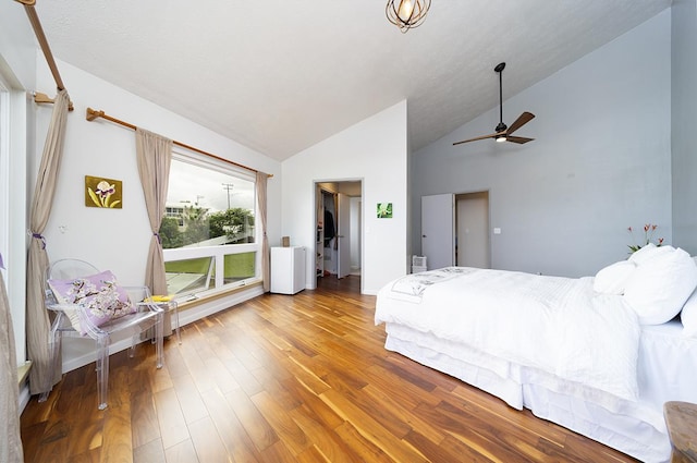 bedroom featuring hardwood / wood-style flooring, ceiling fan, and lofted ceiling