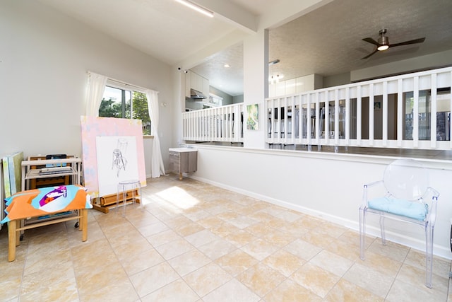 interior space with ceiling fan