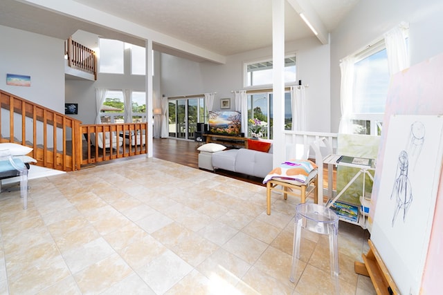 interior space featuring a wealth of natural light and a high ceiling