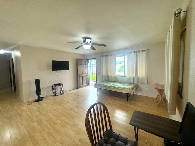 interior space with light hardwood / wood-style floors and ceiling fan