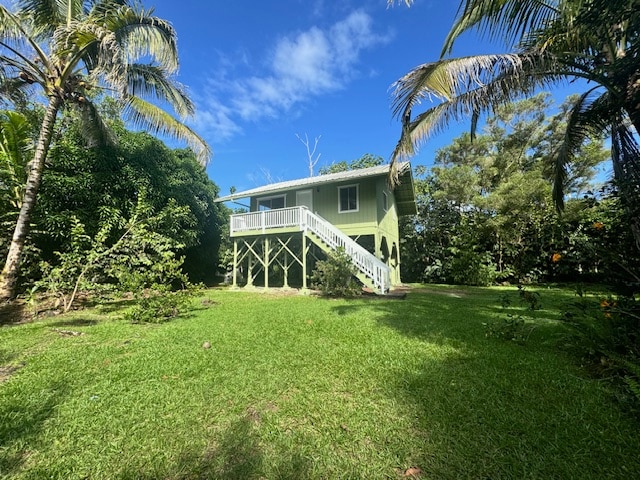 rear view of house with a lawn