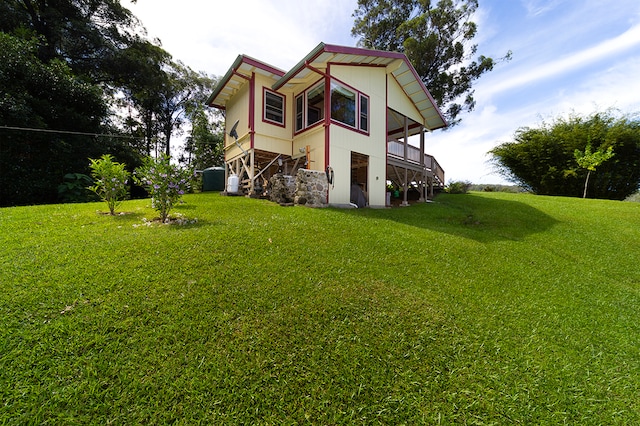 view of side of home featuring a lawn