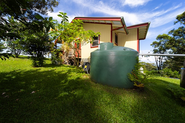 view of side of property featuring a yard