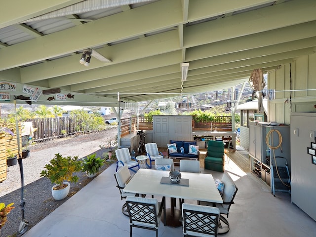 view of patio featuring a storage unit and an outdoor living space